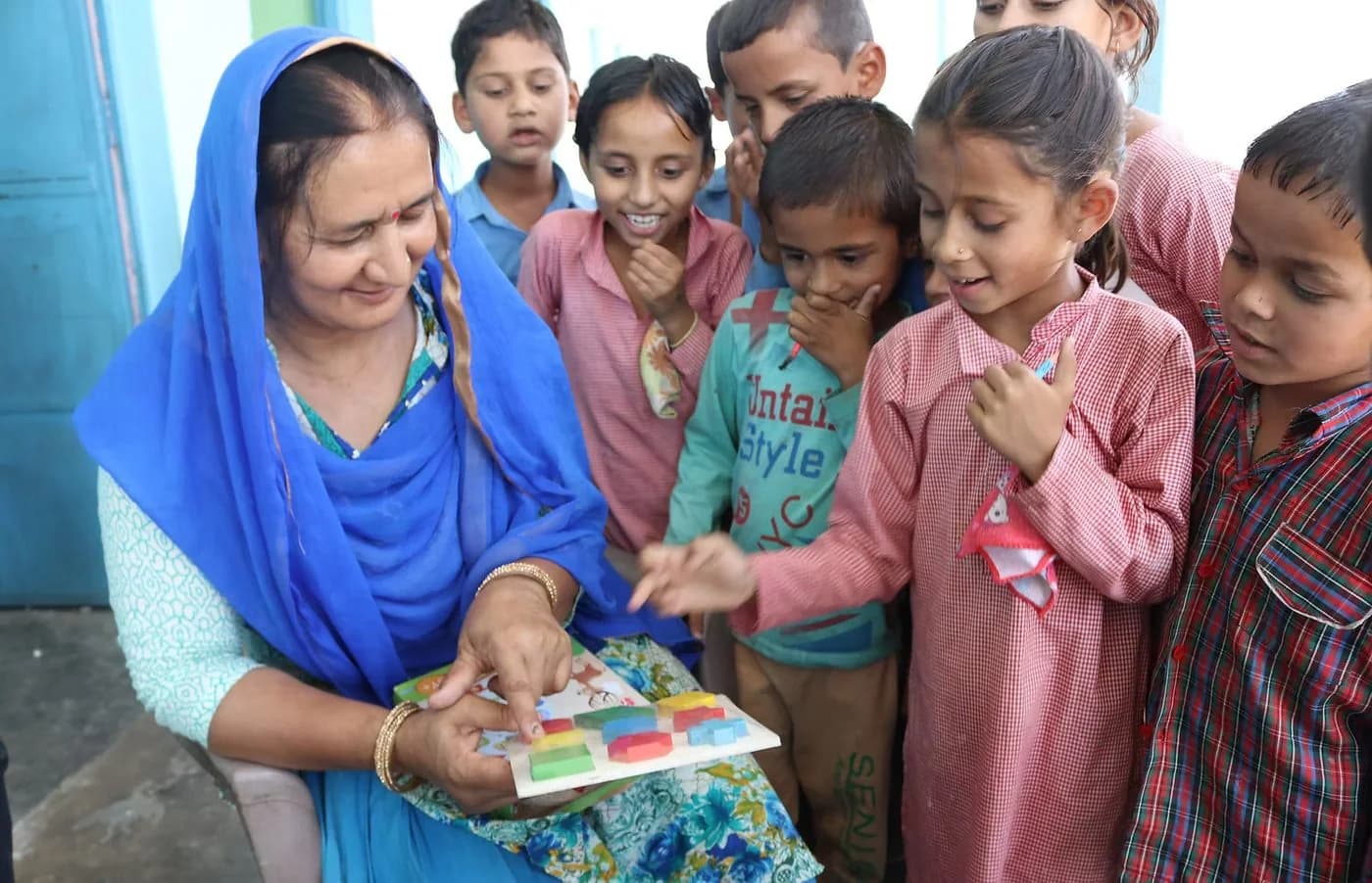 Reading with students in the village. Photo: Project RISHI @ UC Berkeley.